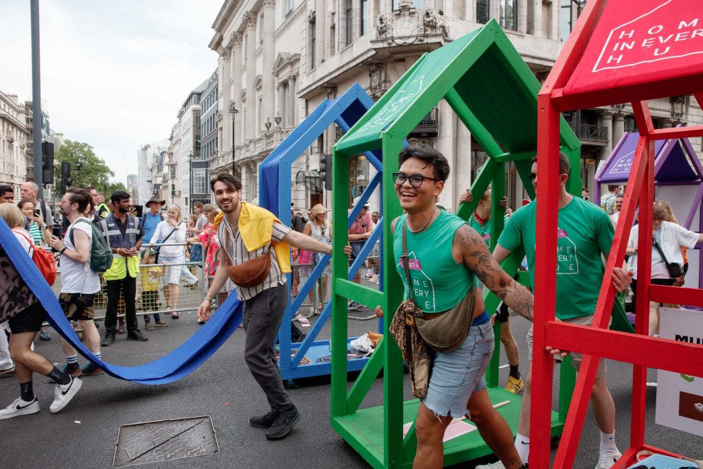 Two men pushing the structures during the parade.